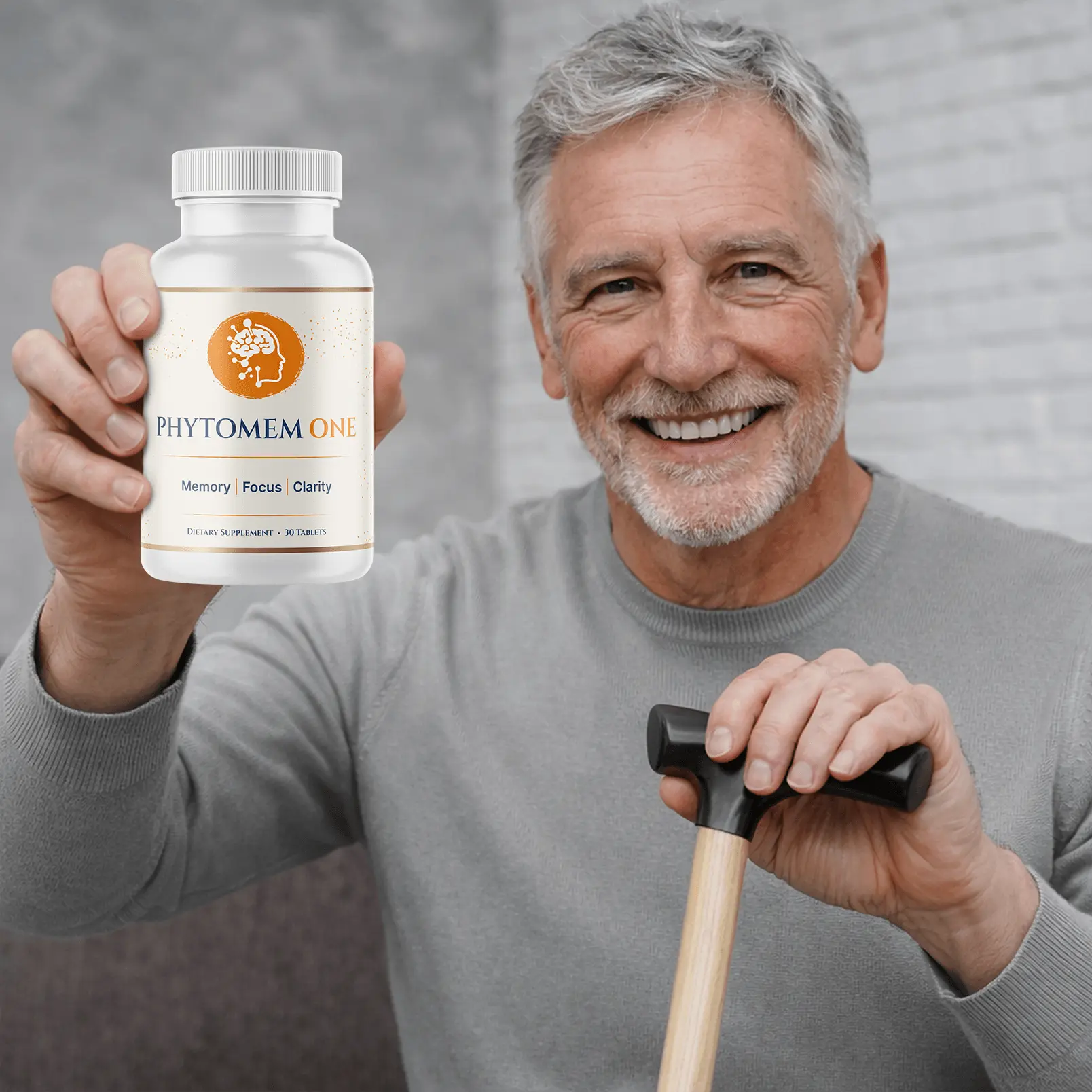 Older man smiling while holding a bottle of Phytomem One